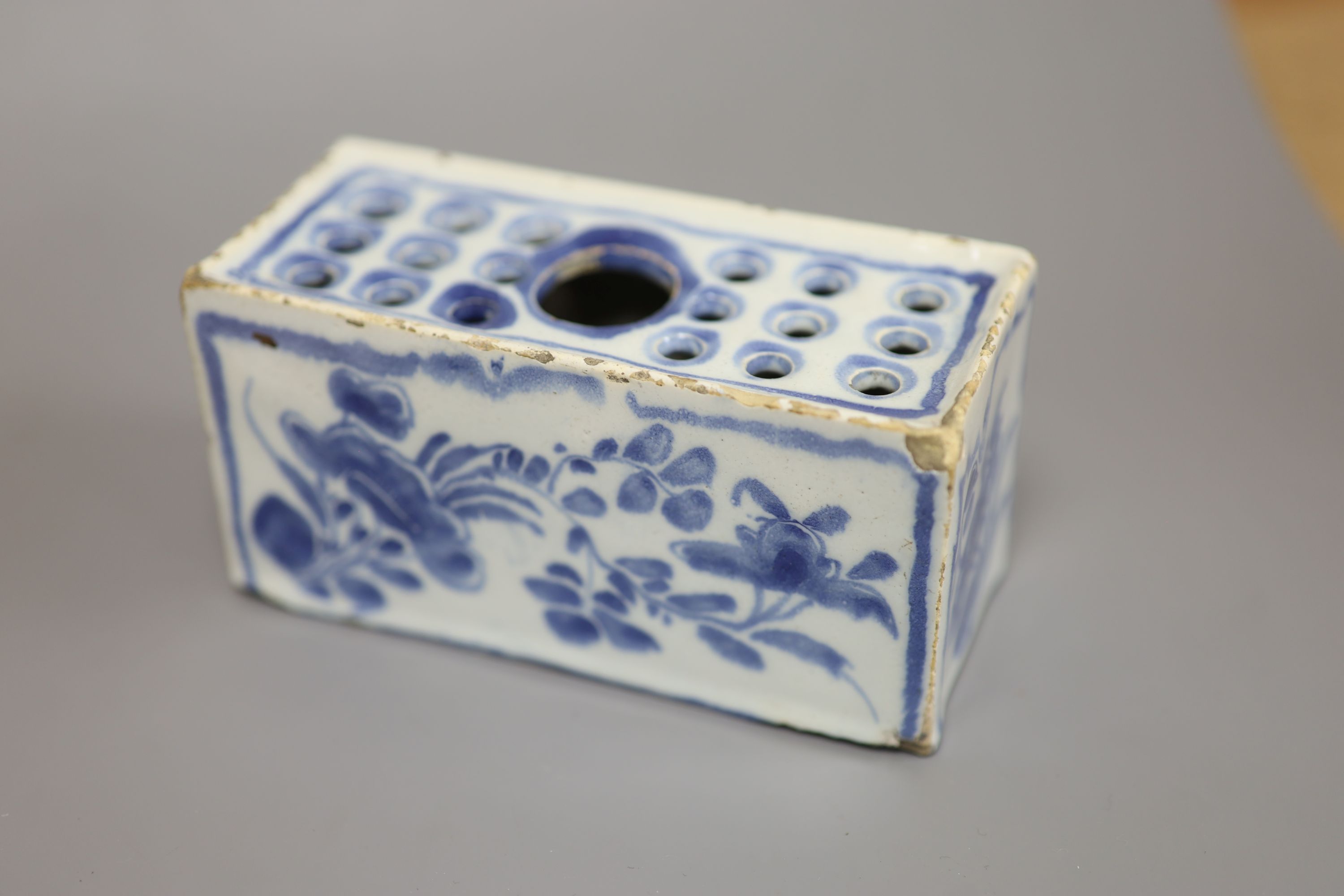 An 18th century Delft ware flower brick, length 12.5cm